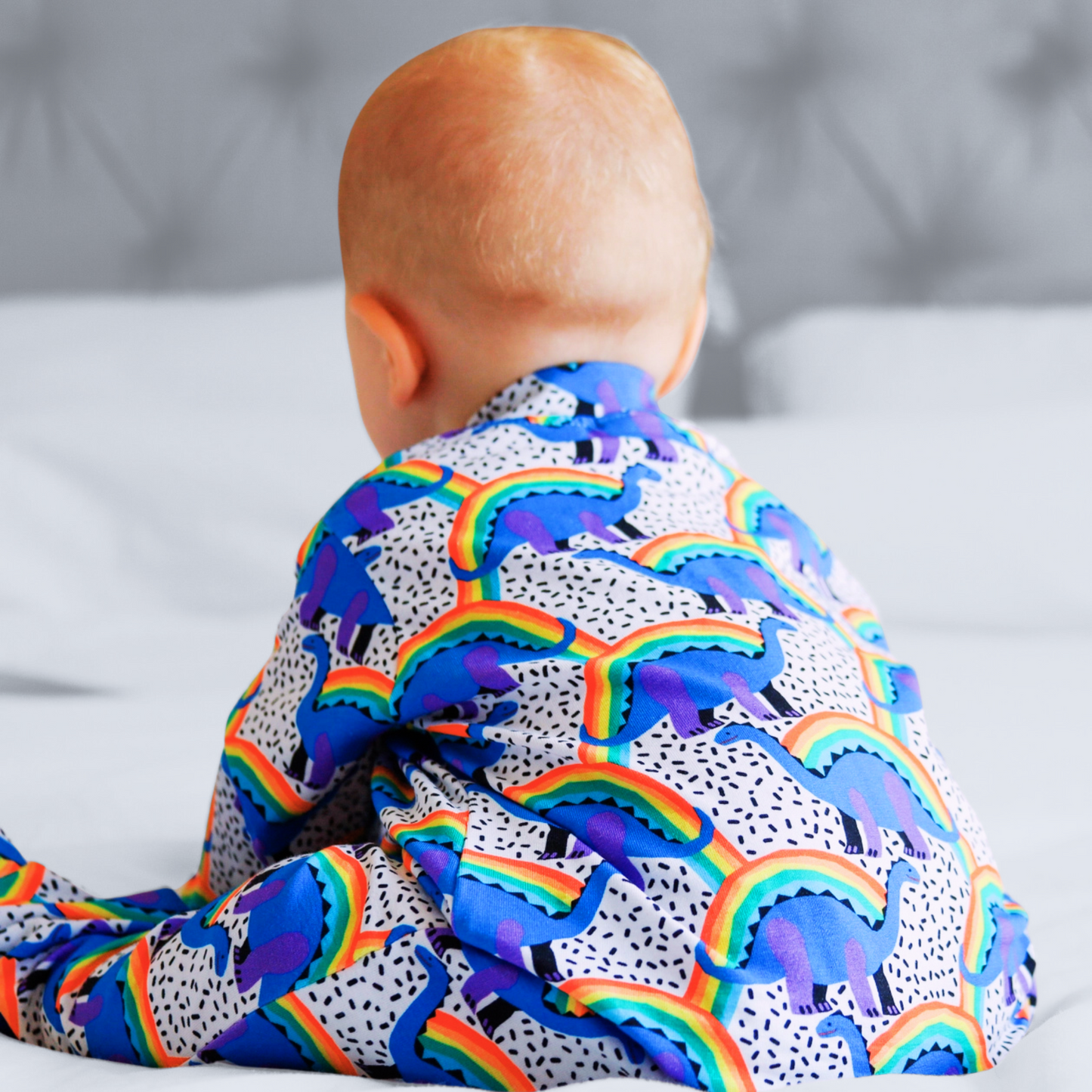 RAINBOW DINO SLEEPSUIT . Up to 18 Months