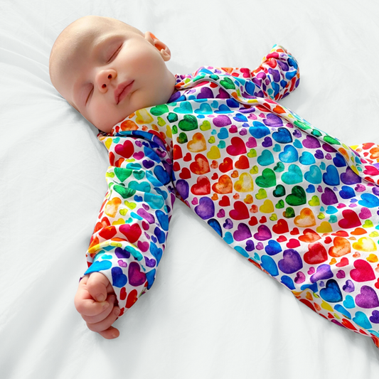 RAINBOW HEART SLEEPSUIT . Up to 18 Months